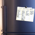 Meal planning template by Living a Sweeter Life is displayed on a silver fridge door